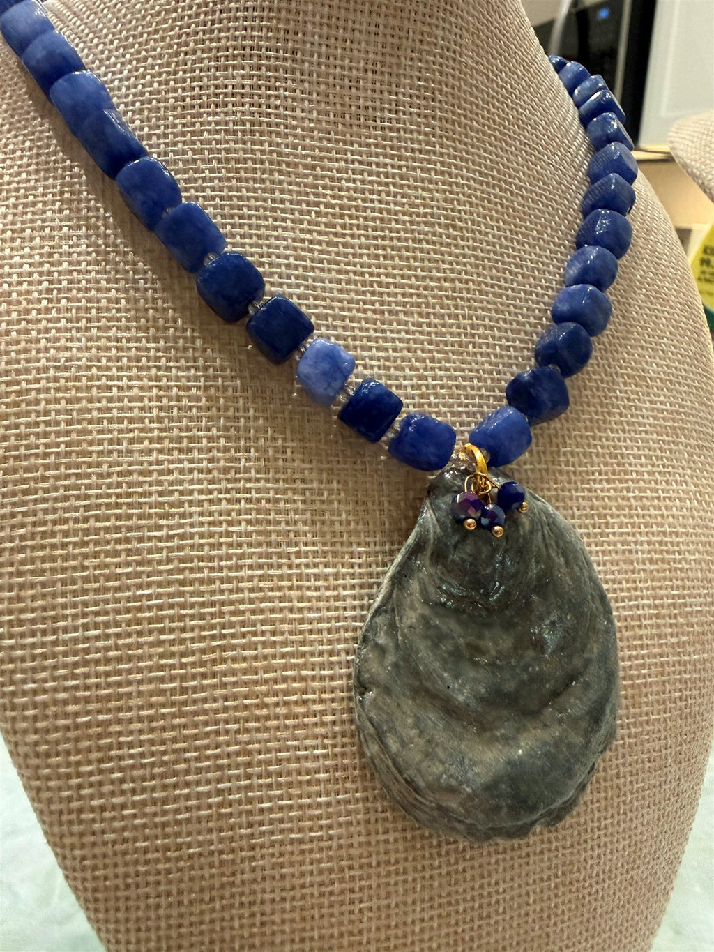 Thetis necklace on a bust form, three-quarter view