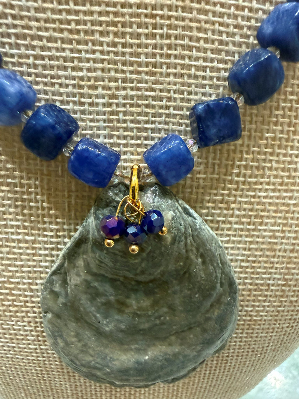 Close-up of the dark blue sodalite cubes and gold wire